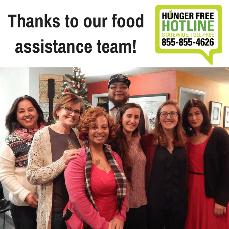 Image of our client services team, smiling and posing for a picture with a Christmas tree in the background. At the top sits the Food Resource Hotline logo and the text, "Thanks to our food assistance team!"