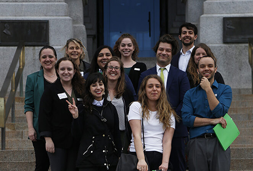photo of staff in front of capital building